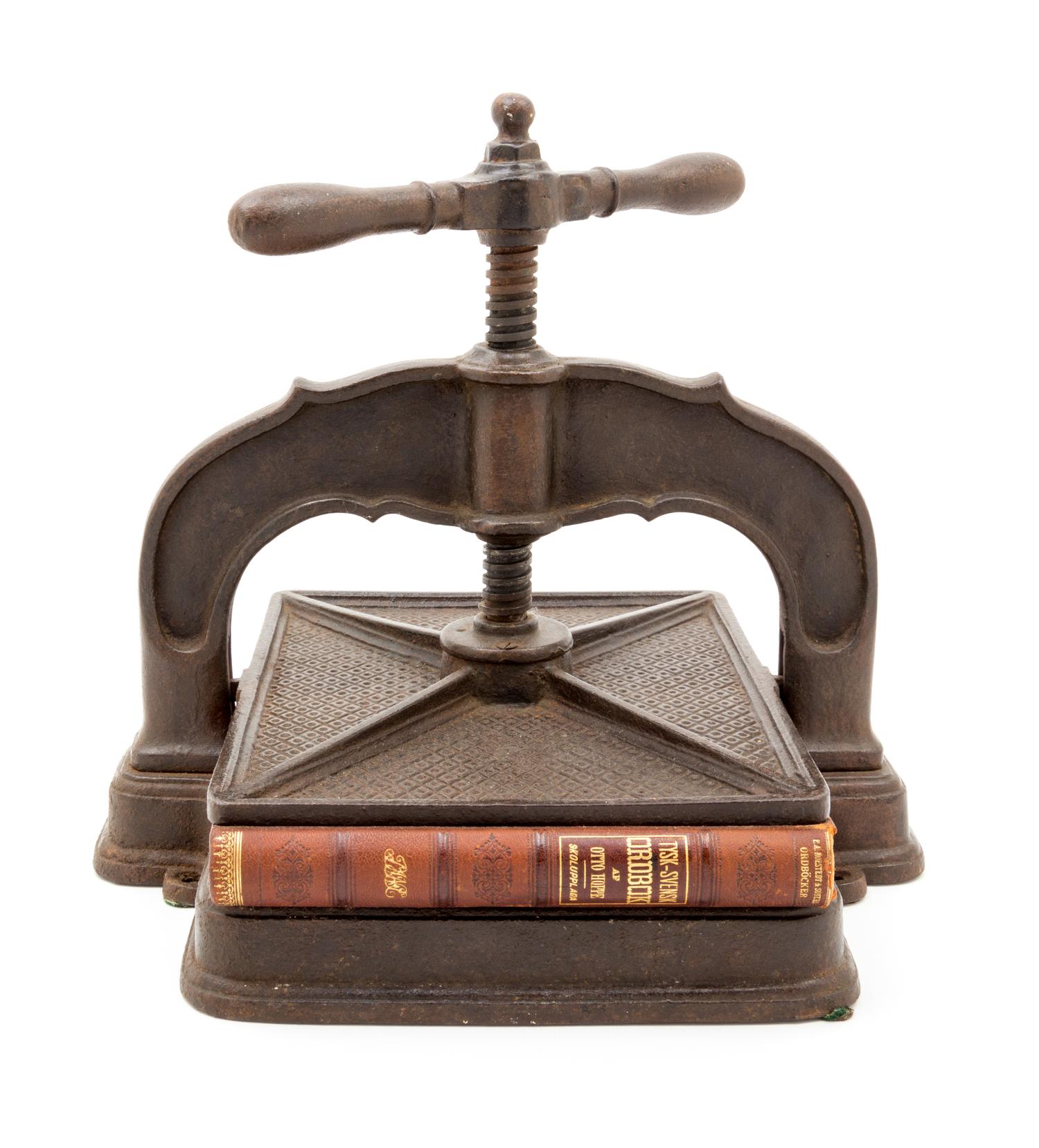 An Iron Book Press Height 11 3/4 inches. — 20TH CENTURY