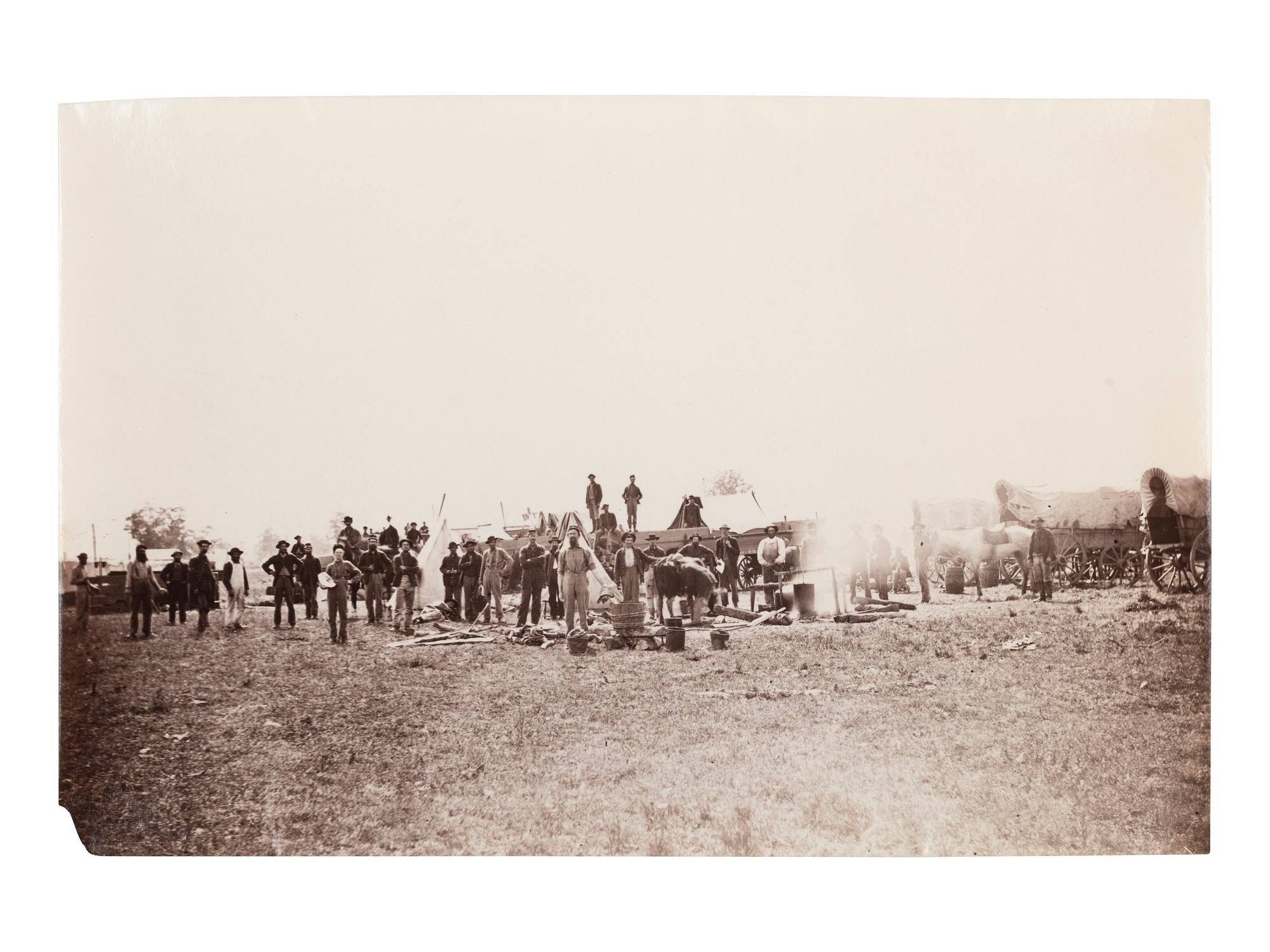 [CIVIL WAR]. Photographer unknown. View of unidentified company of soldiers and civilians in the field. 1861-1865.
