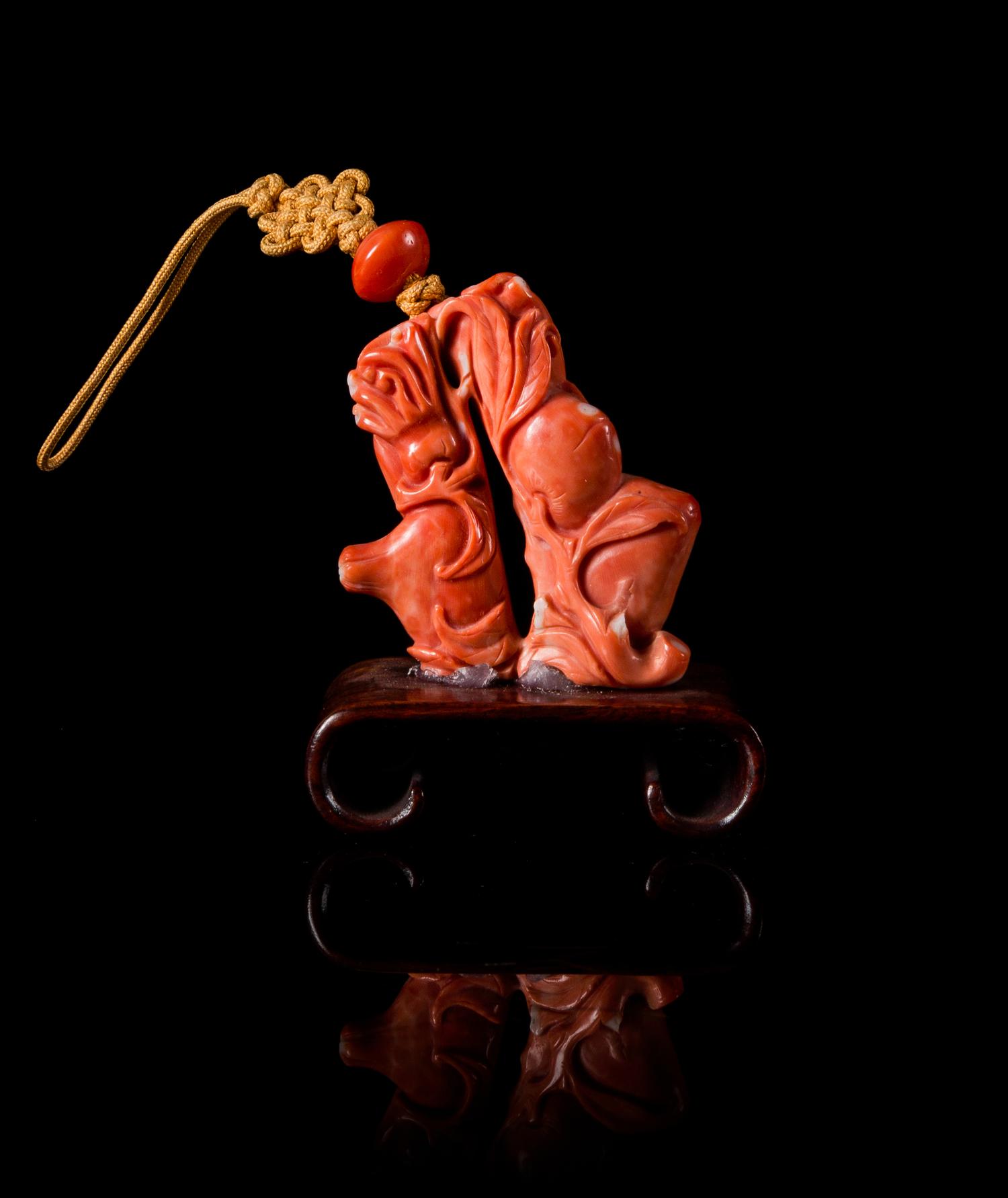 A Small Red Coral Carving Height 2 inches.