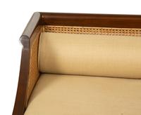 A Contemporary Walnut and Cane Daybed