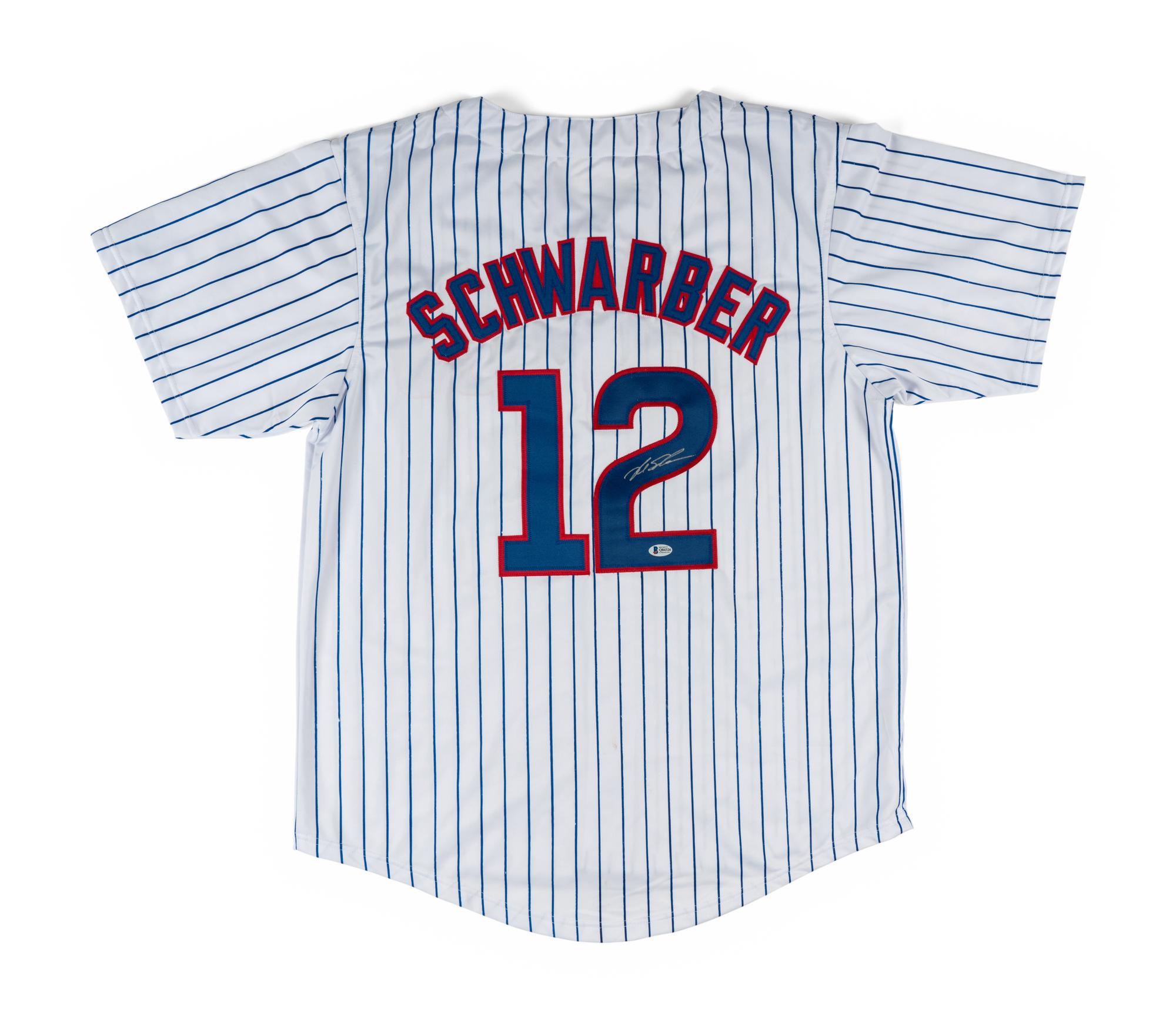 A Large Group of Chicago Cubs Memorabilia Featuring a Signed Kyle Schwarber Jersey
