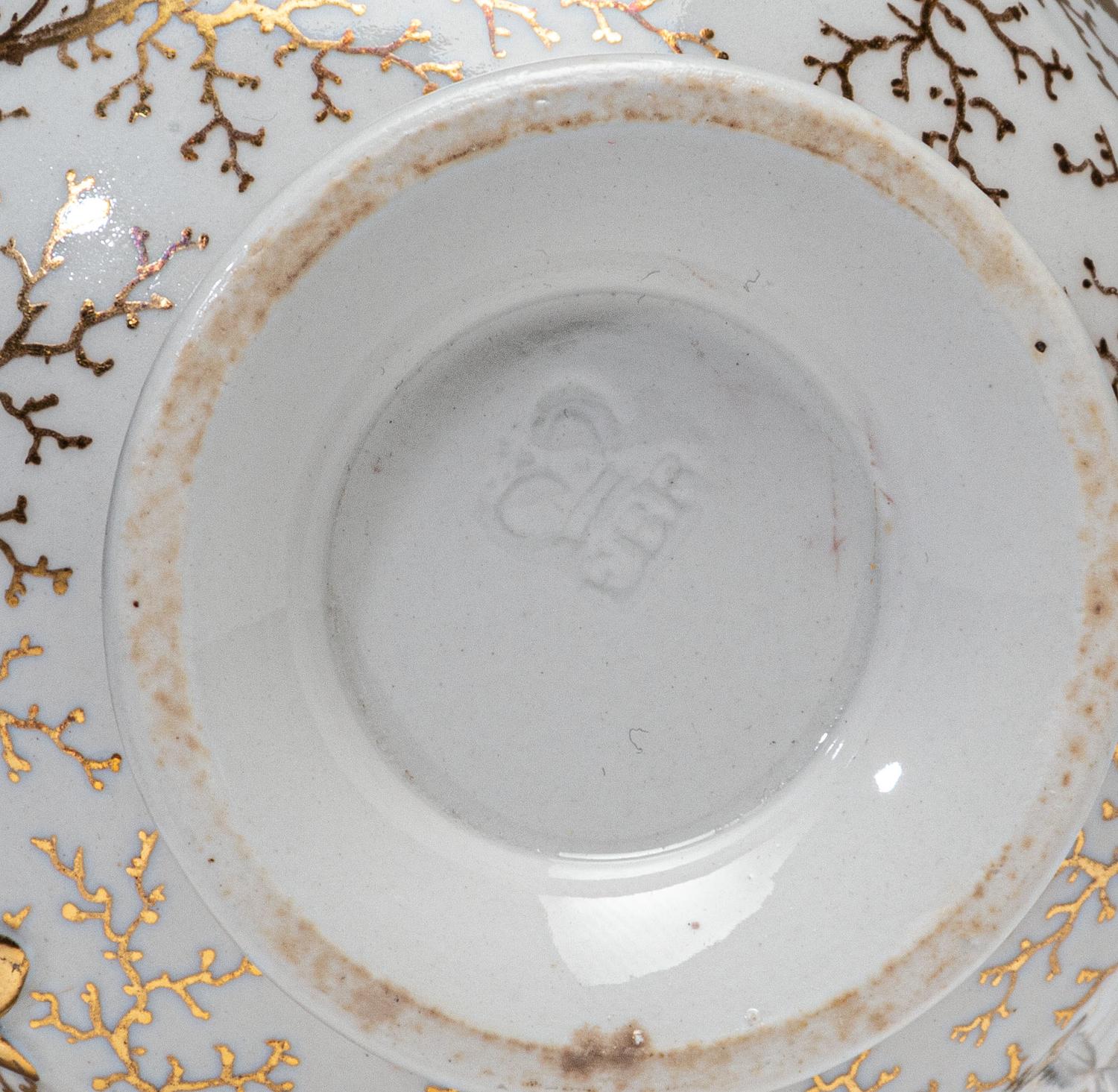 A Worcester Porcelain 'Shell-Encrusted' Basket, Cup and Saucer