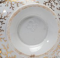 A Worcester Porcelain 'Shell-Encrusted' Basket, Cup and Saucer