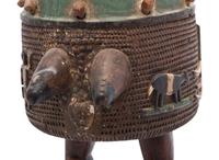 An Ashanti Carved and Gouged Painted Wood Breasted Drum