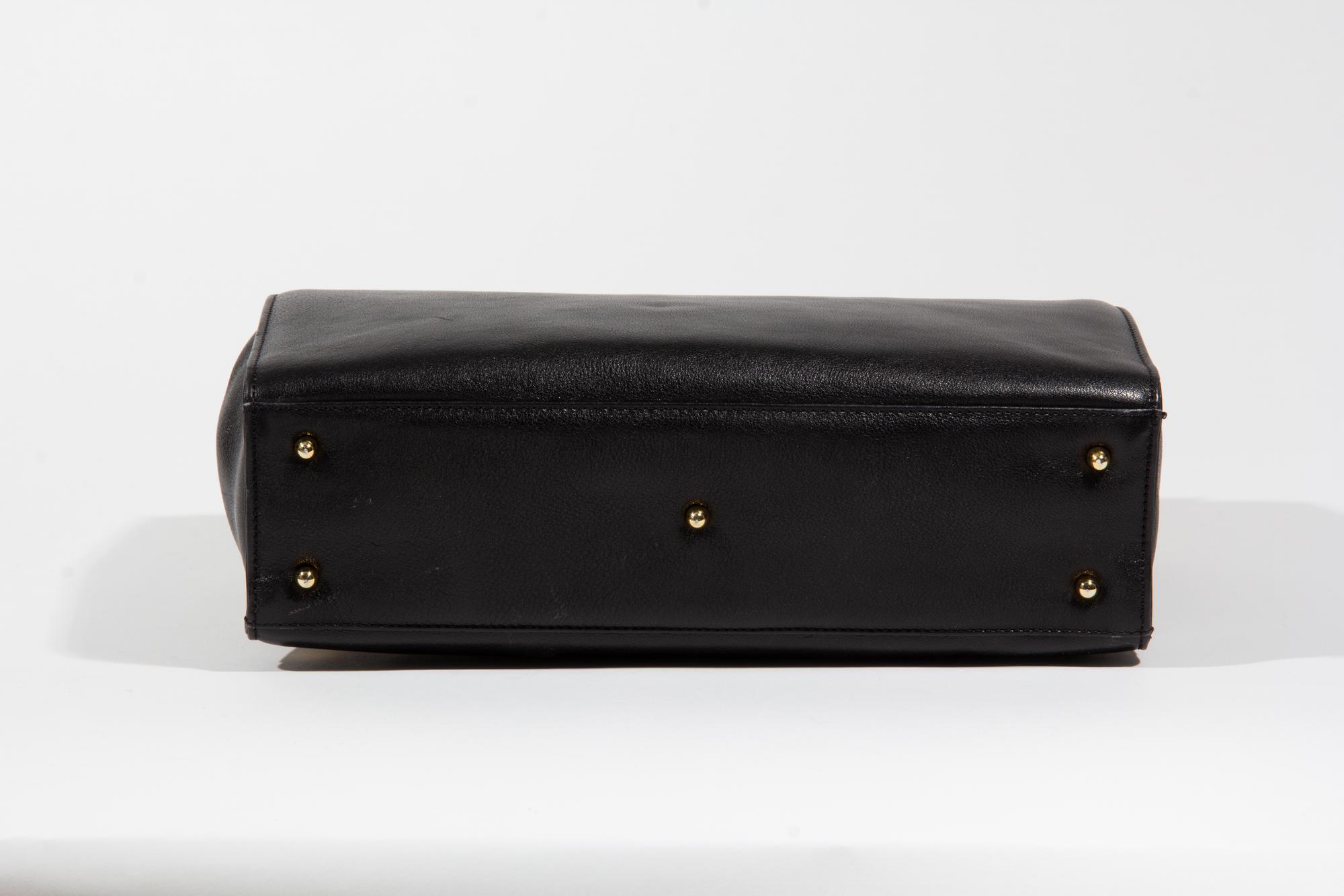 A Gianni Versace Black Leather Medusa Shoulder Bag, 11.75" x 8.5" x 3.5"; Strap drop: 19.5".