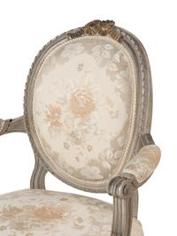 A Pair of Louis XVI Style Gray-Painted and Parcel-Gilt Armchairs