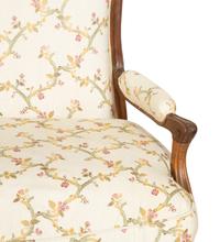 A Pair of Louis XV Style Carved Mahogany Fauteuils