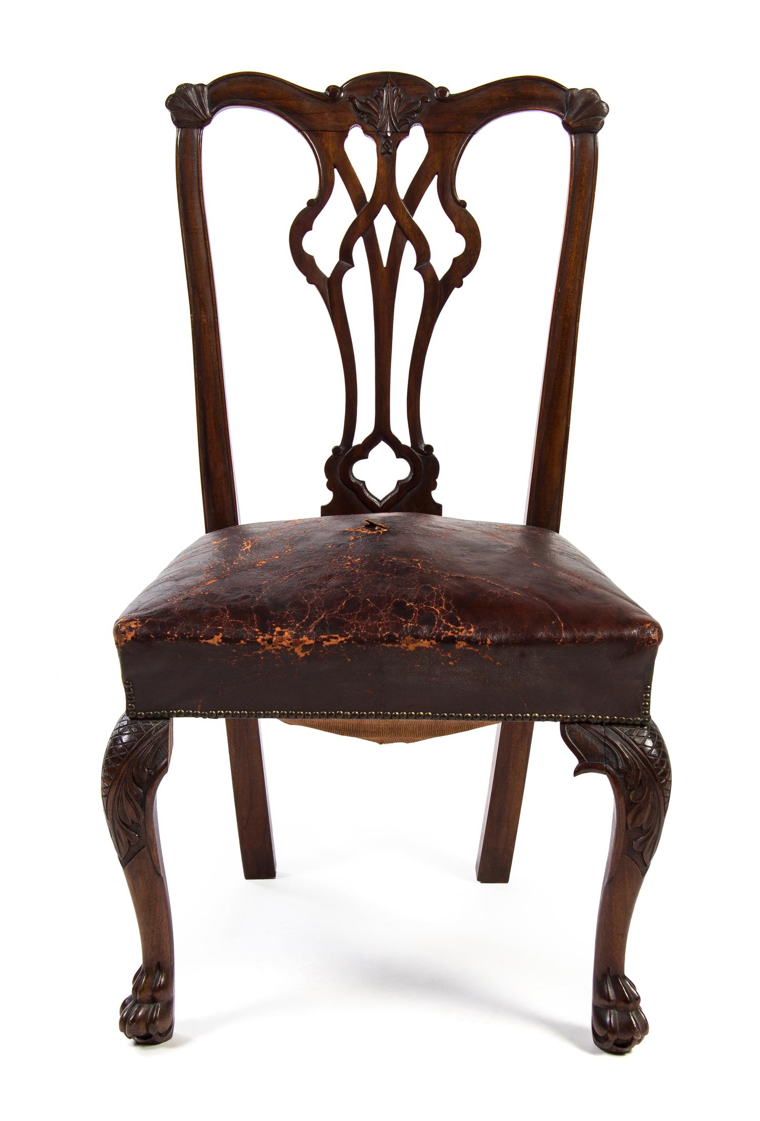 A Set of Six Irish Chippendale Style Dining Chairs, Height 38 1/2 inches.