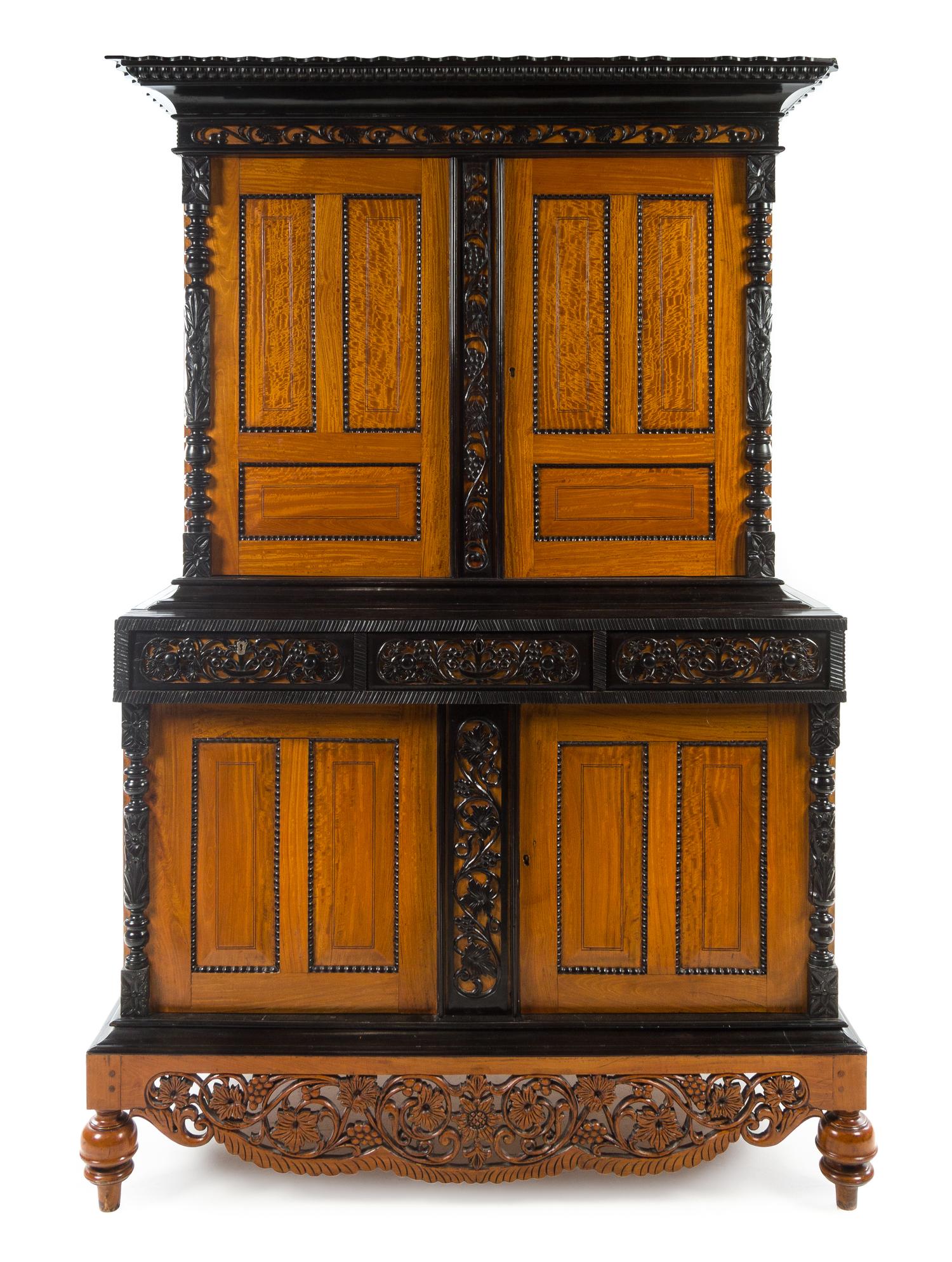 An Indo-Dutch Parcel Ebonized Satinwood Cabinet Height 84 1/4 x width 56 x depth 32 1/2 inches. — 19TH CENTURY