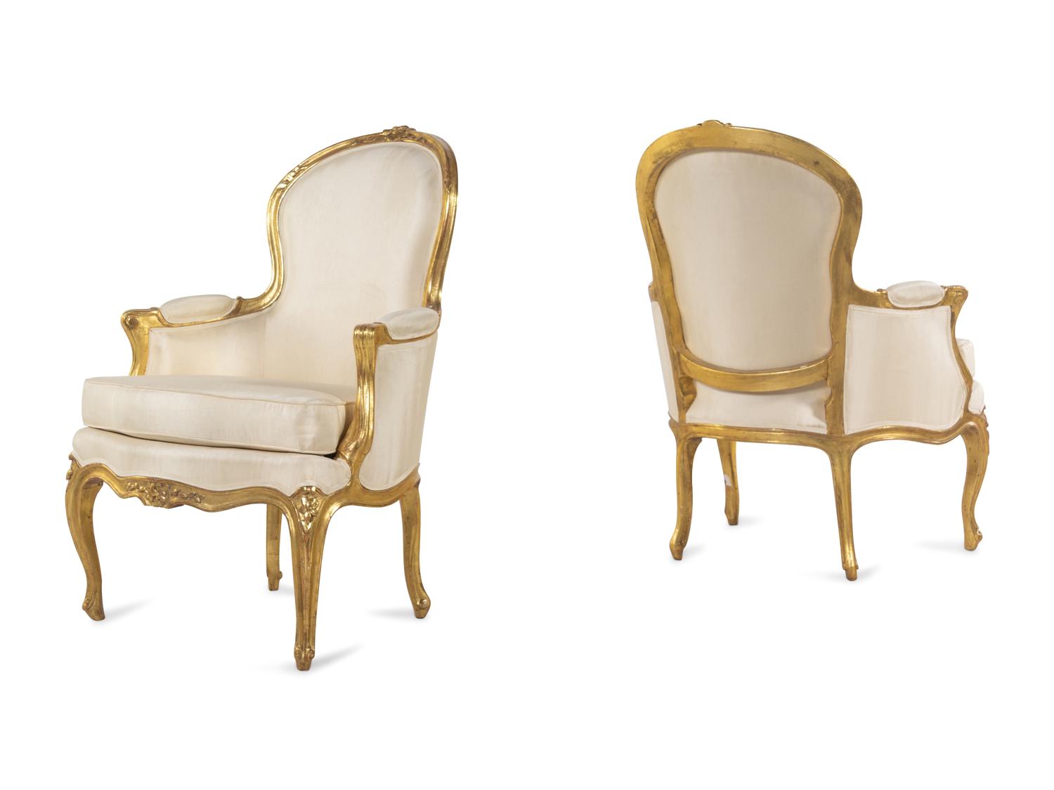 A Pair of Louis XV Carved Giltwood Bergères