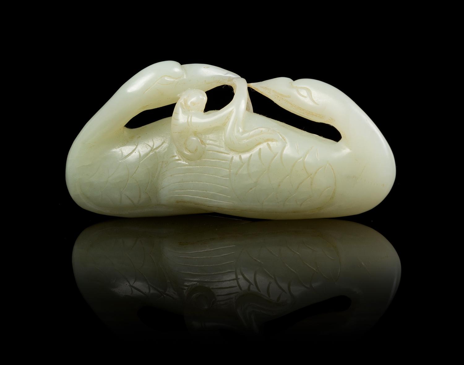 A Carved Jade Toggle Length 3 inches.
