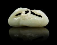 A Carved Jade Toggle Length 3 inches.