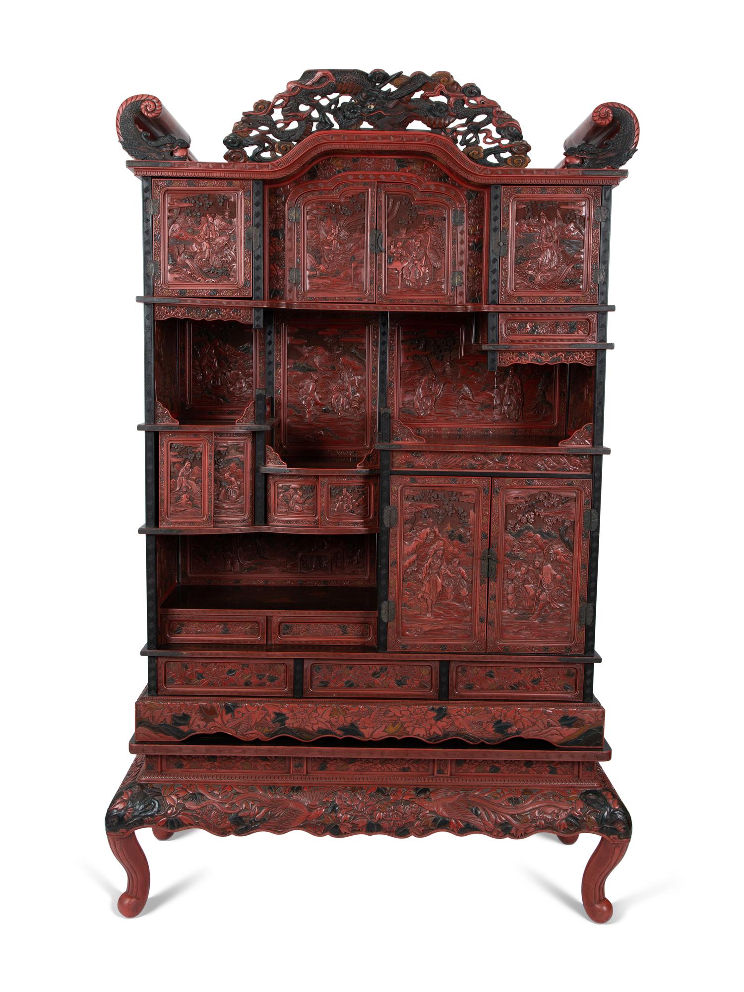 A Chinese Export Carved Red Lacquer Curio Cabinet — EARLY 20TH CENTURY