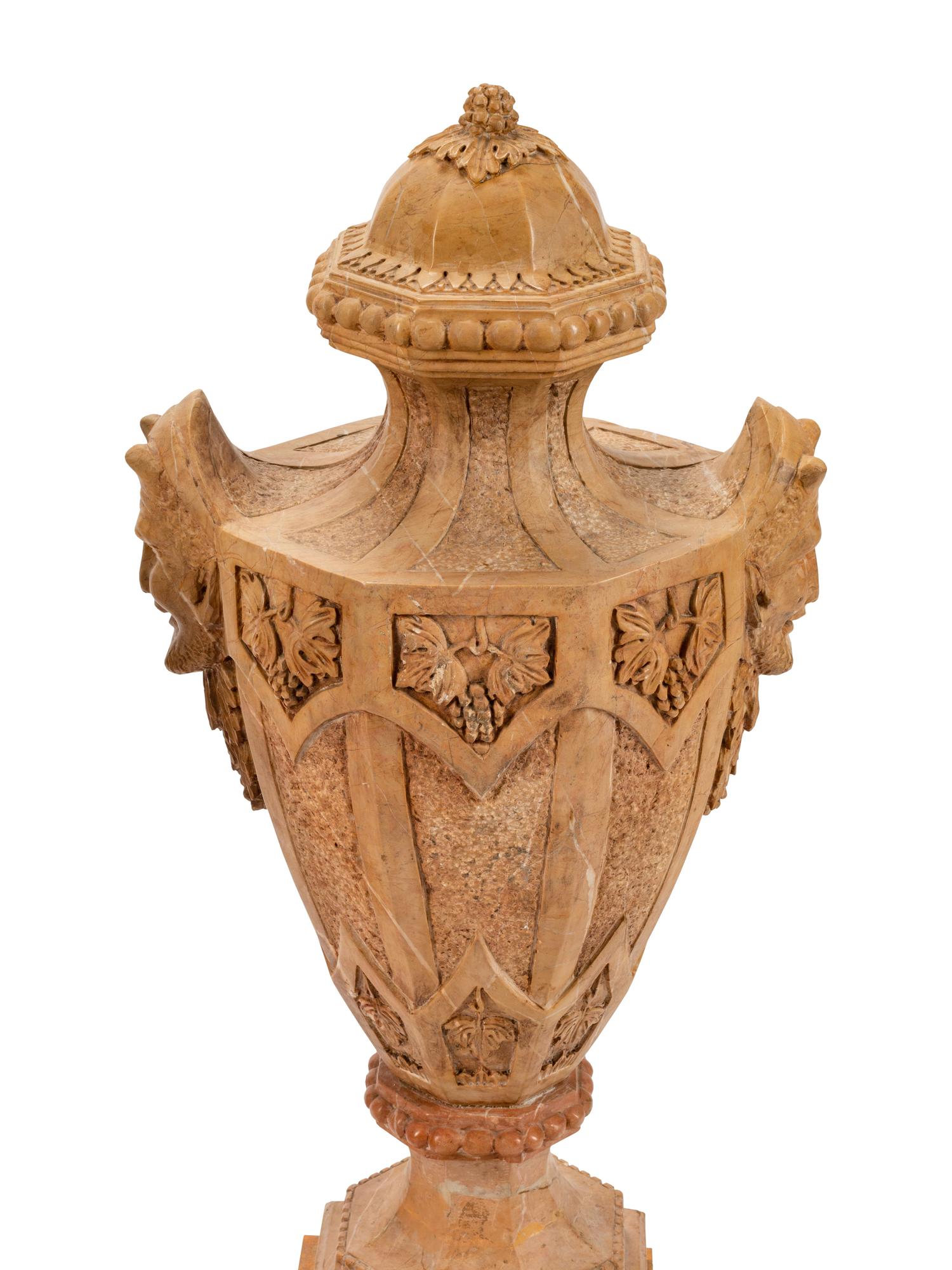 A Pair of Gothic Style Marble Urns with Satyr Handles
