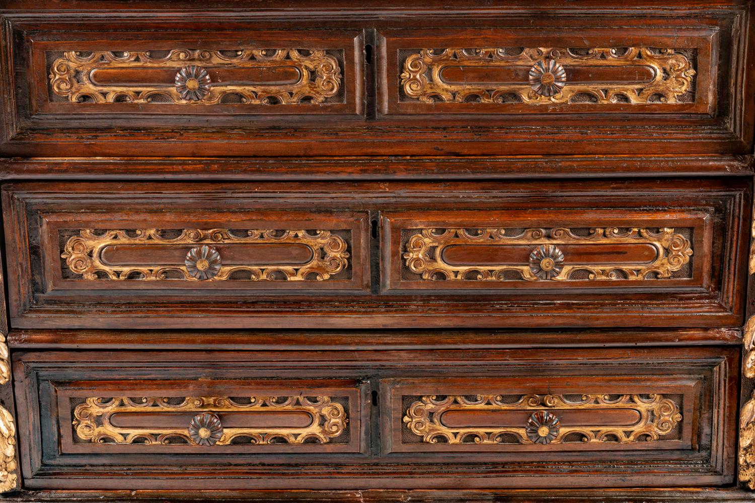 An Italian Baroque Parcel Gilt Walnut Chest of Drawers