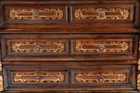 An Italian Baroque Parcel Gilt Walnut Chest of Drawers