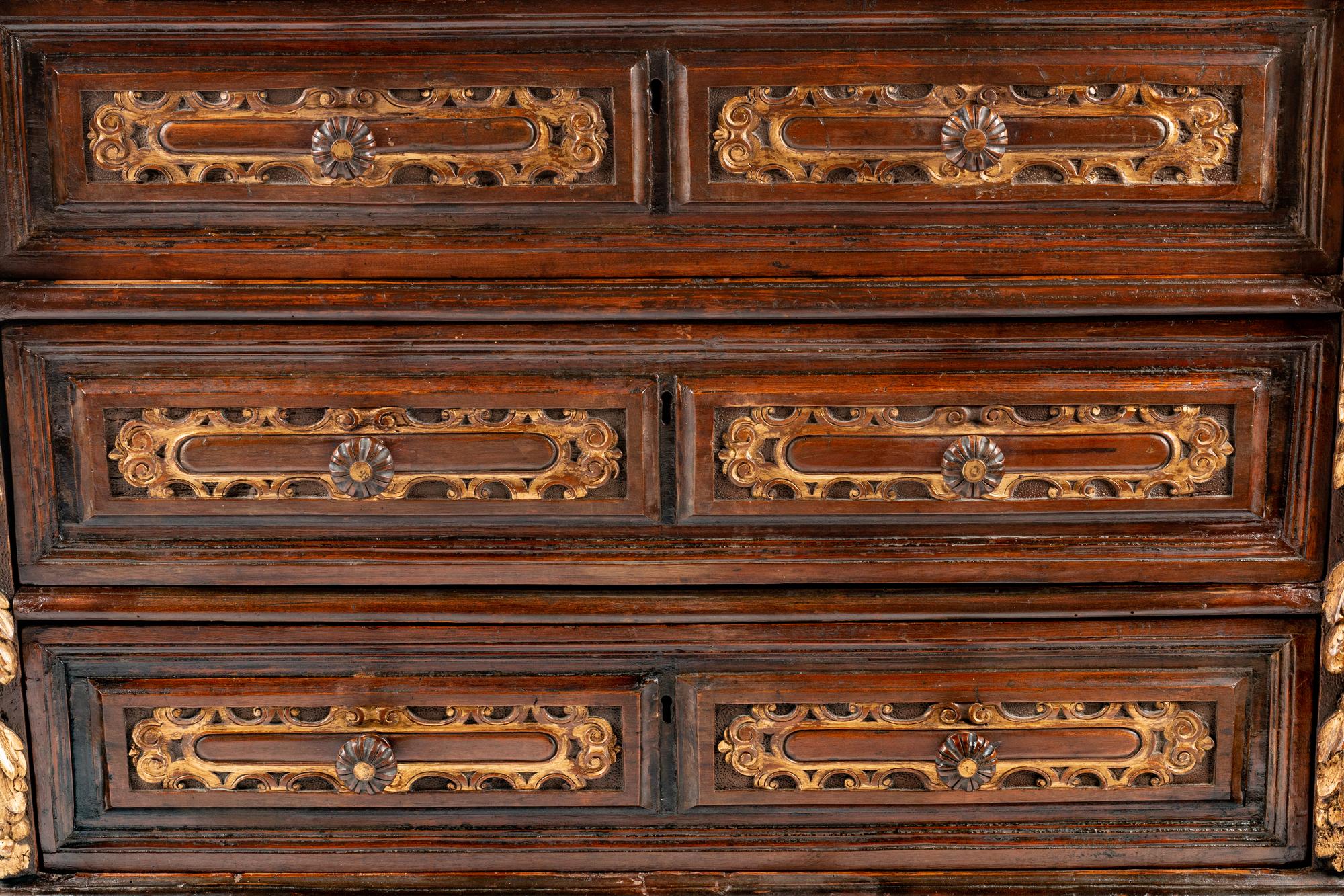 An Italian Baroque Parcel Gilt Walnut Chest of Drawers