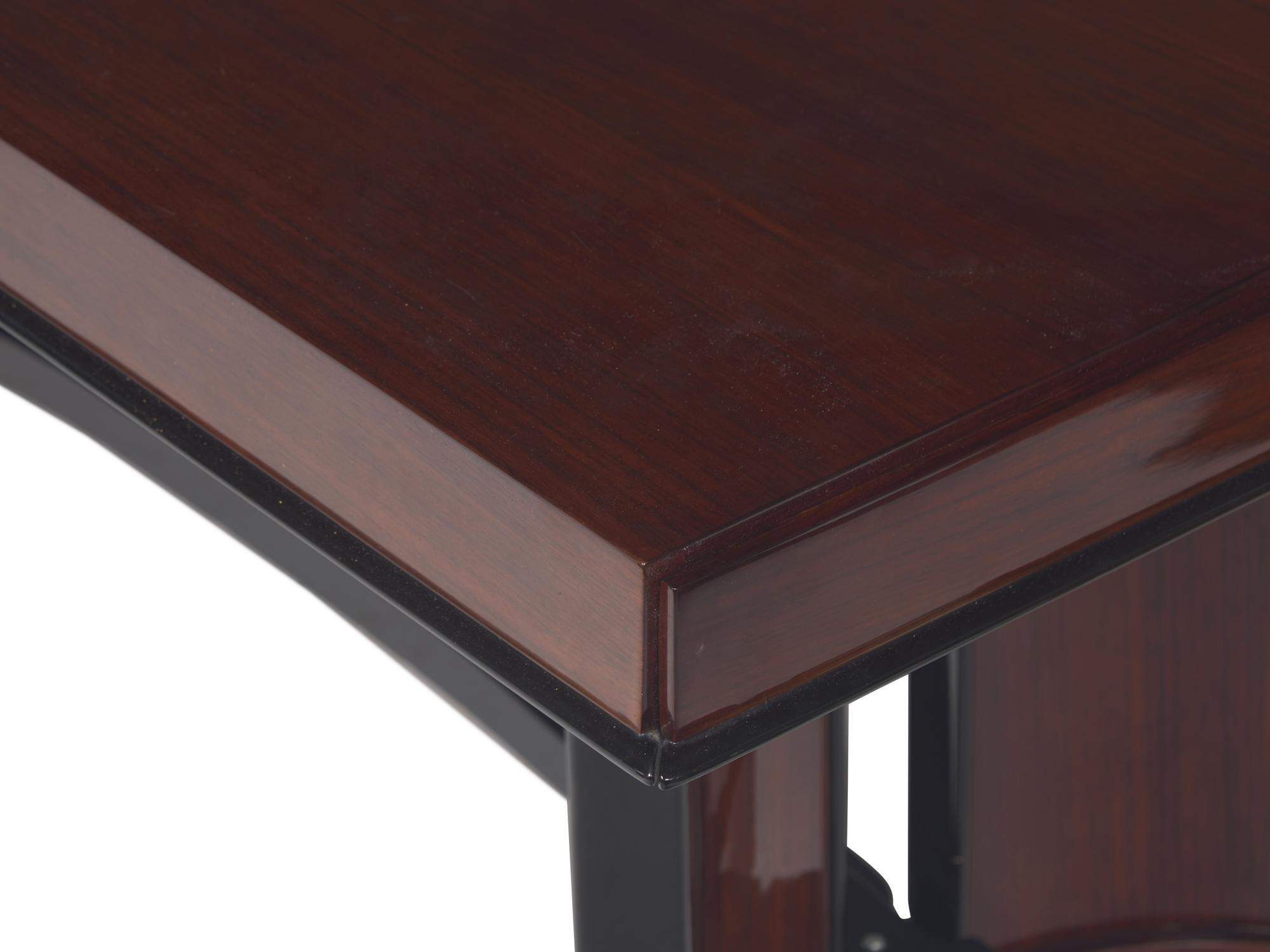 An Art Deco Rosewood and Ebonized Draw-End Dining Table
