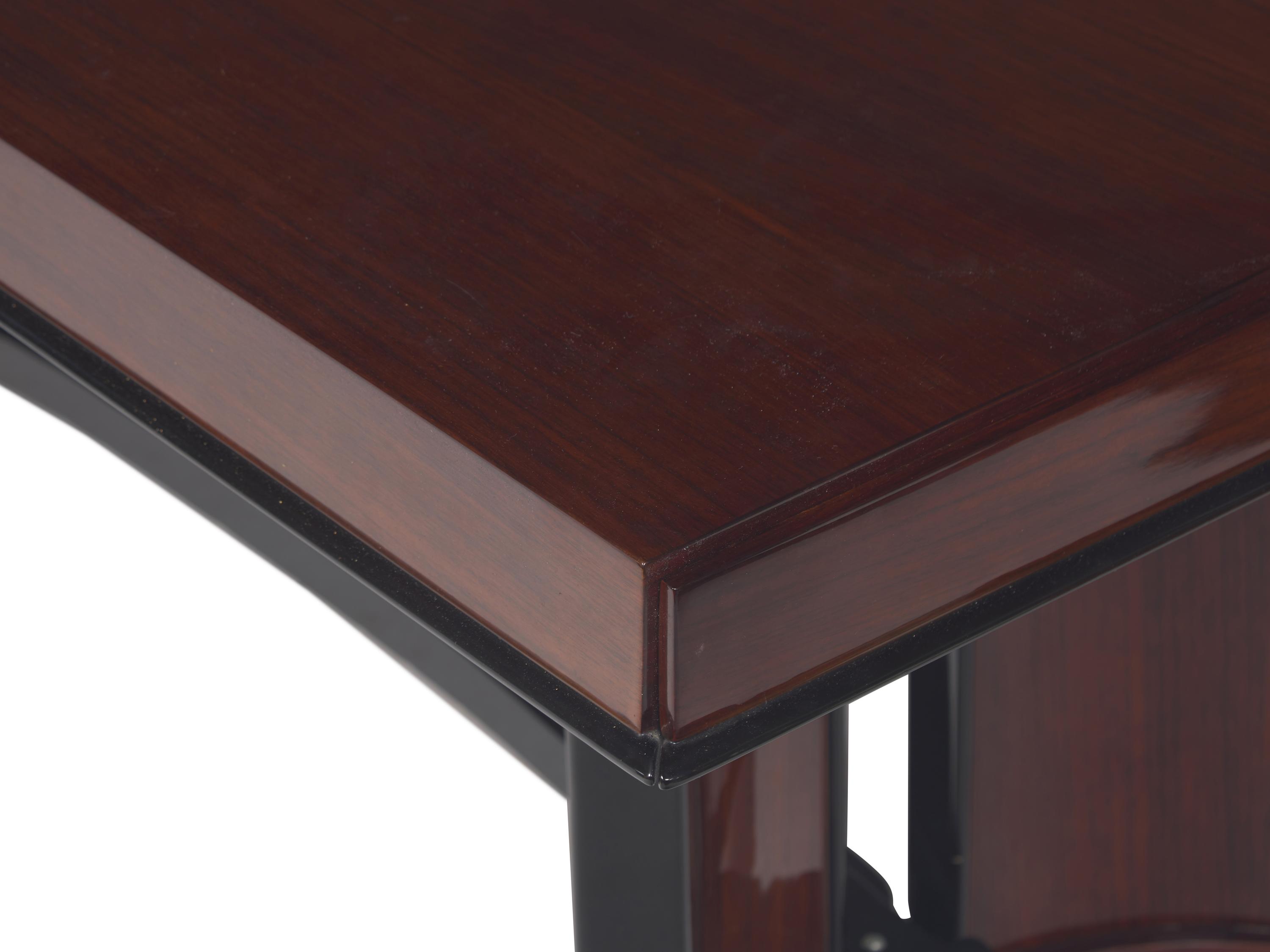 An Art Deco Rosewood and Ebonized Draw-End Dining Table