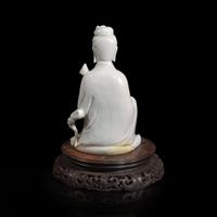 A Chinese blanc de Chine figure of Guanyin seated, with lotus 白瓷持莲观音像 Boji Yuren seal mark ?????