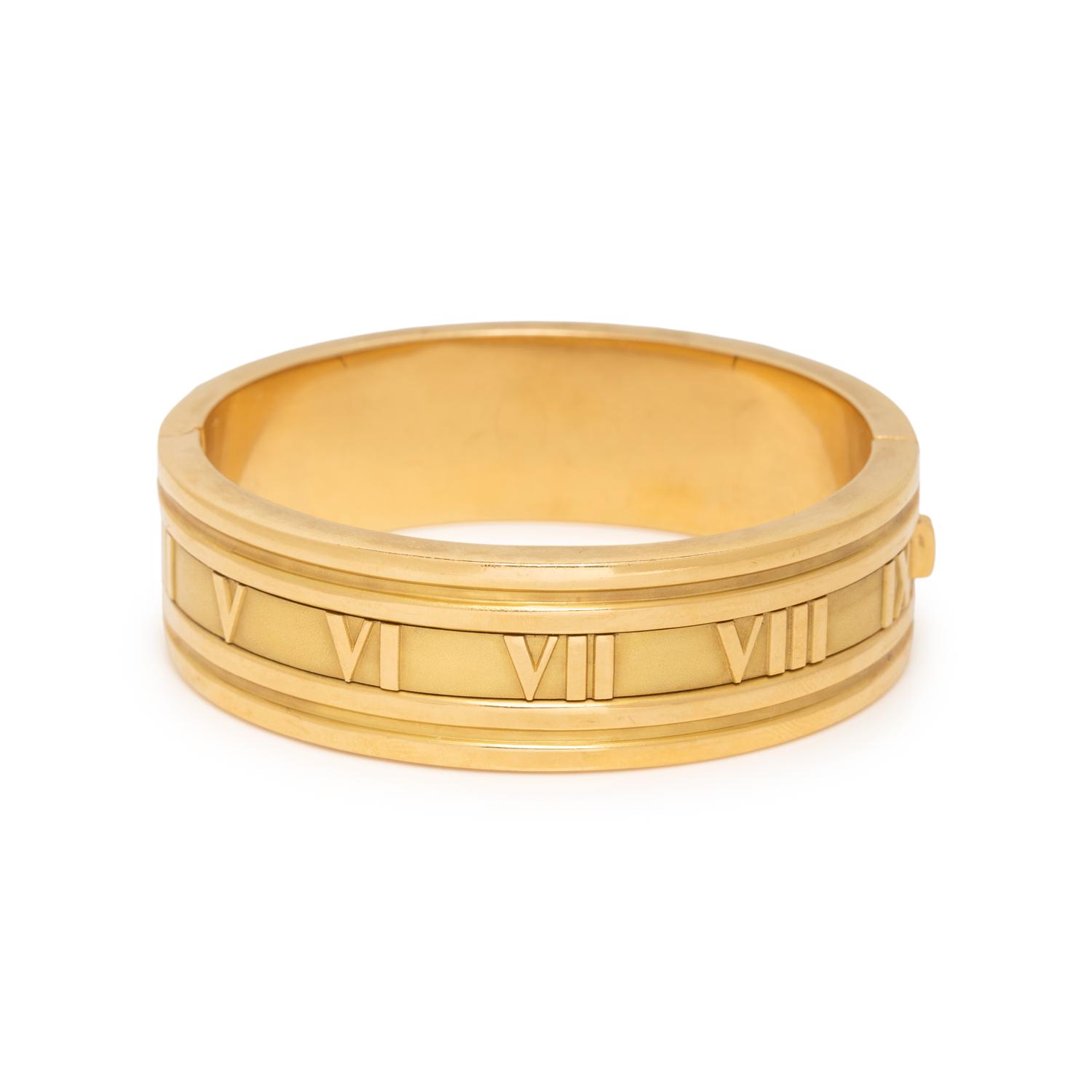 TIFFANY & CO., YELLOW GOLD 'ATLAS' HINGED BANGLE BRACELET