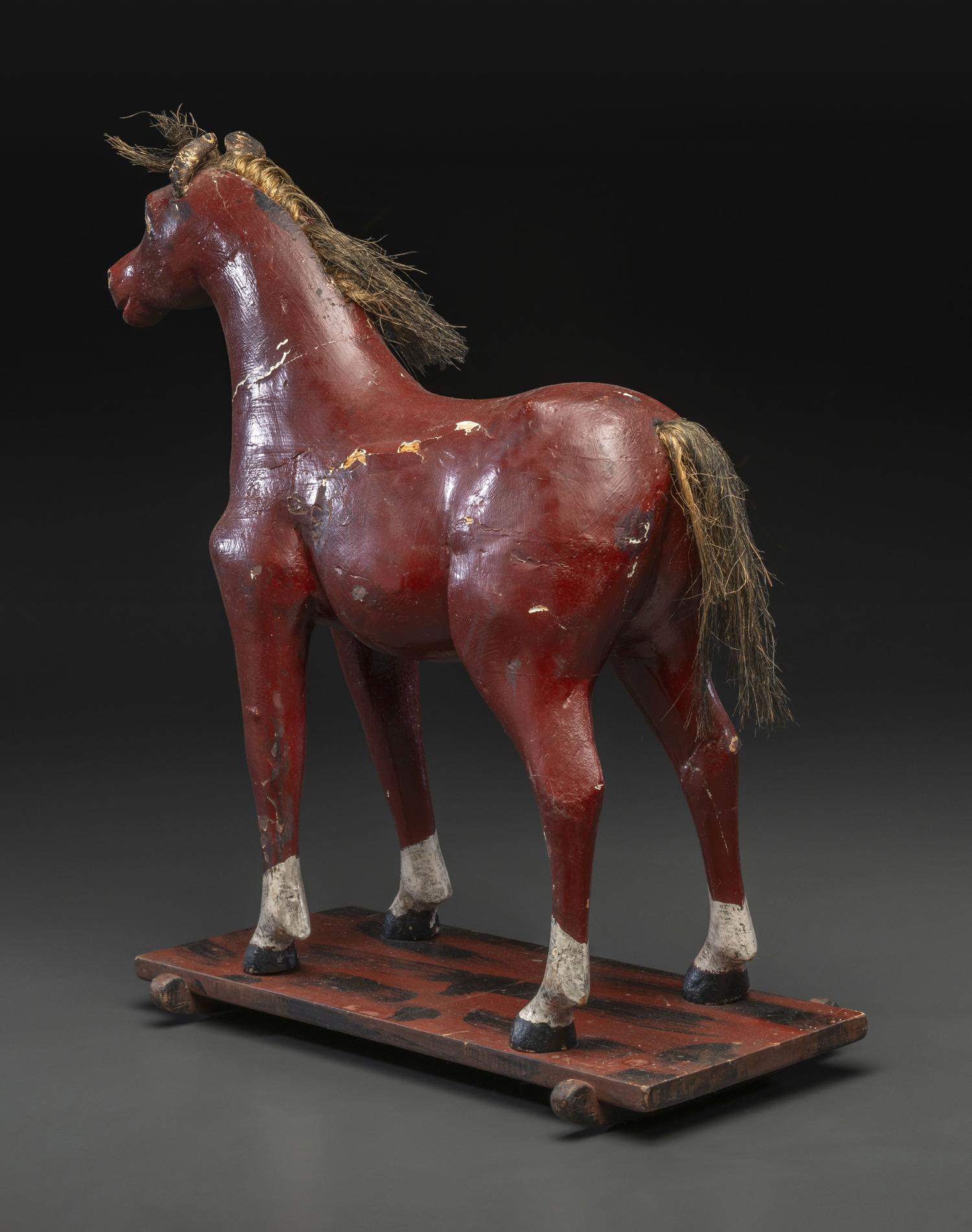 A Carved and Painted Wood Horse Pull Toy