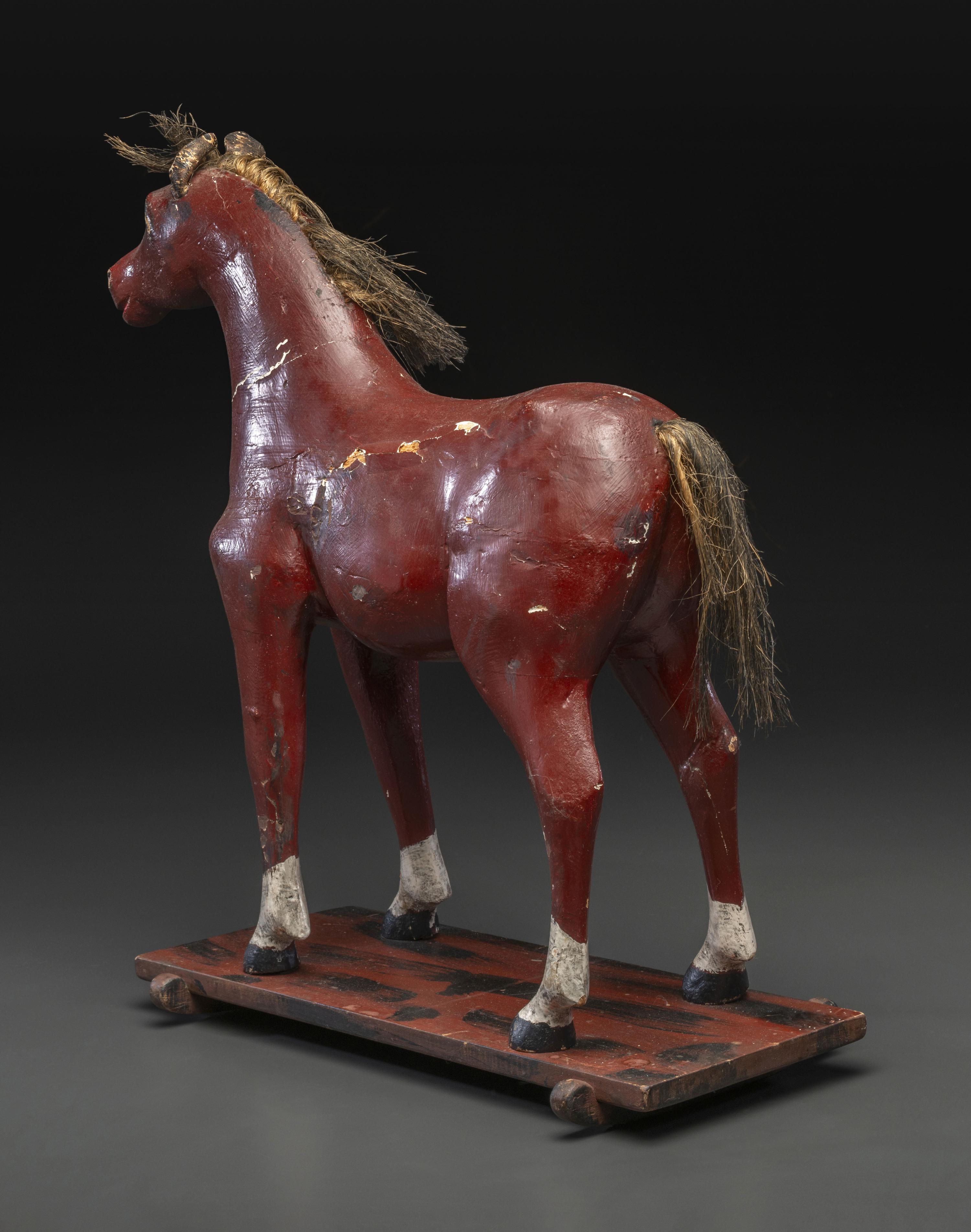 A Carved and Painted Wood Horse Pull Toy