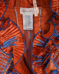 Three Pleated Items: One Zandra Rhodes Bolero and Dress, and One Mary McFadden Dress with Belt, 1980s