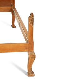 A Pair of Venetian Style Fruitwood and Parcel Gilt Twin Beds