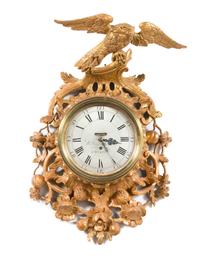 An Early George III Giltwood Cartel Clock Height 32 x width 18 inches. — CIRCA 1760-70
