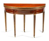 A Louis XVI Style Brass-Mounted Mahogany Triple-Top Demilune Games Table