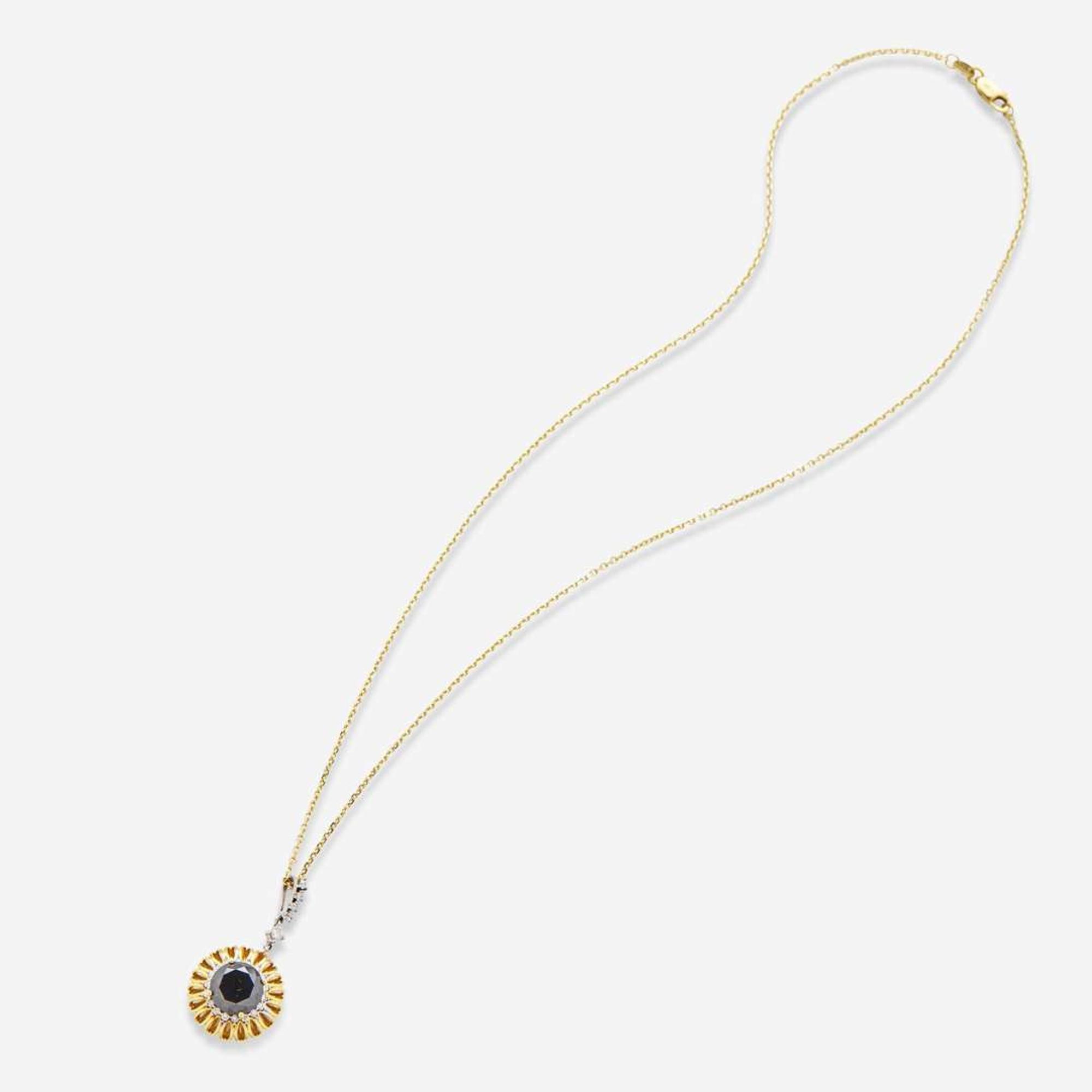 An 18K Yellow Gold Black Diamond and Diamond Pendant on a 14K Chain