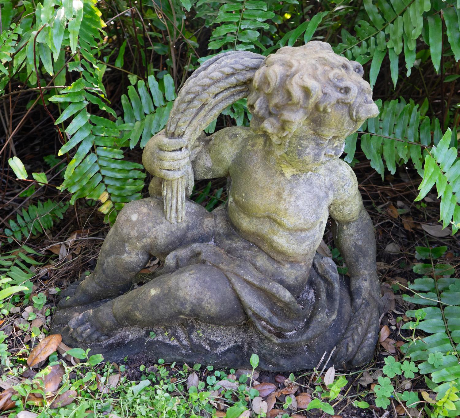 A Pair of Cast Stone Seated Putti