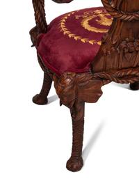 A Set of Four Carved Walnut Elephant Motif Fantasy Chairs