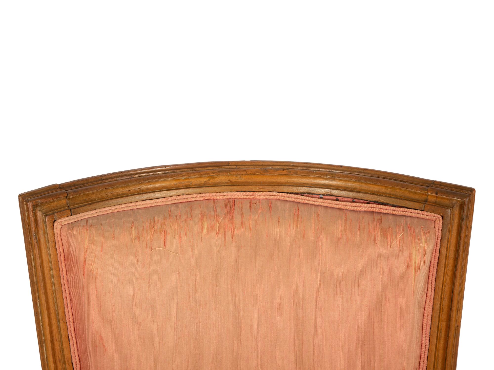 A Louis XVI Carved Walnut Bergère