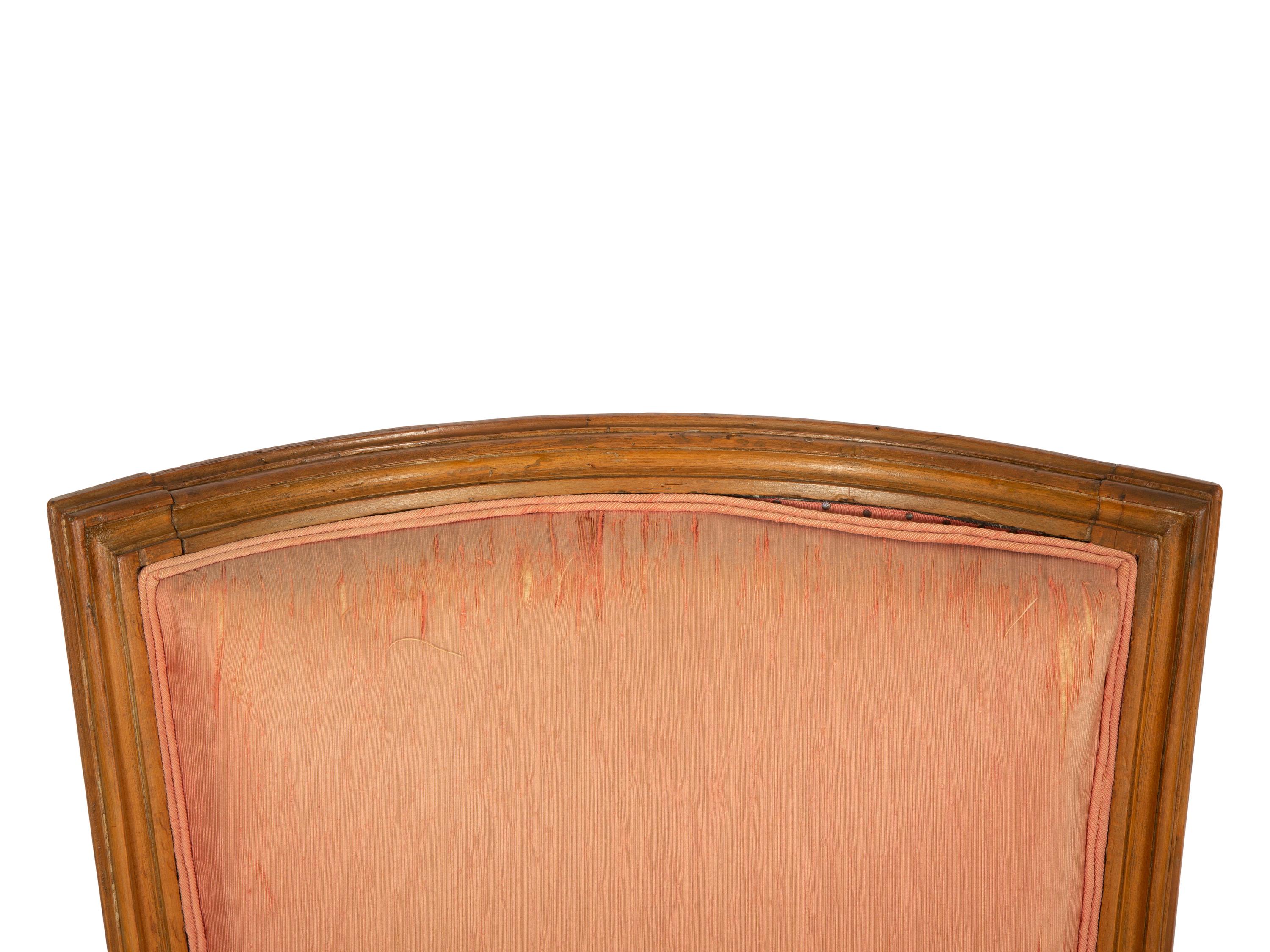 A Louis XVI Carved Walnut Bergère