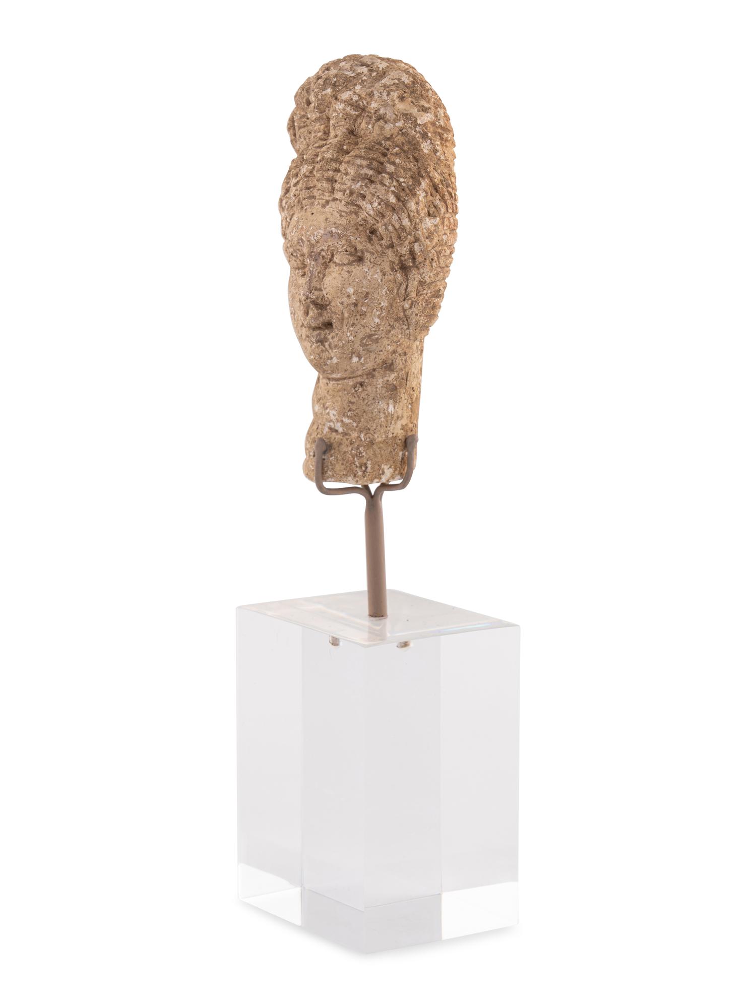 A Roman Stone Head of a Woman