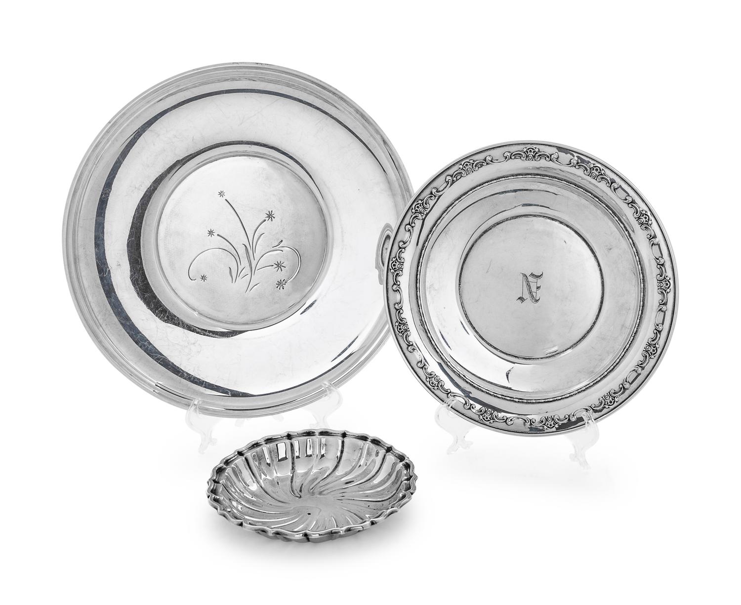 comprising a round platter and two shallow dishes.