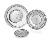 comprising a round platter and two shallow dishes.
