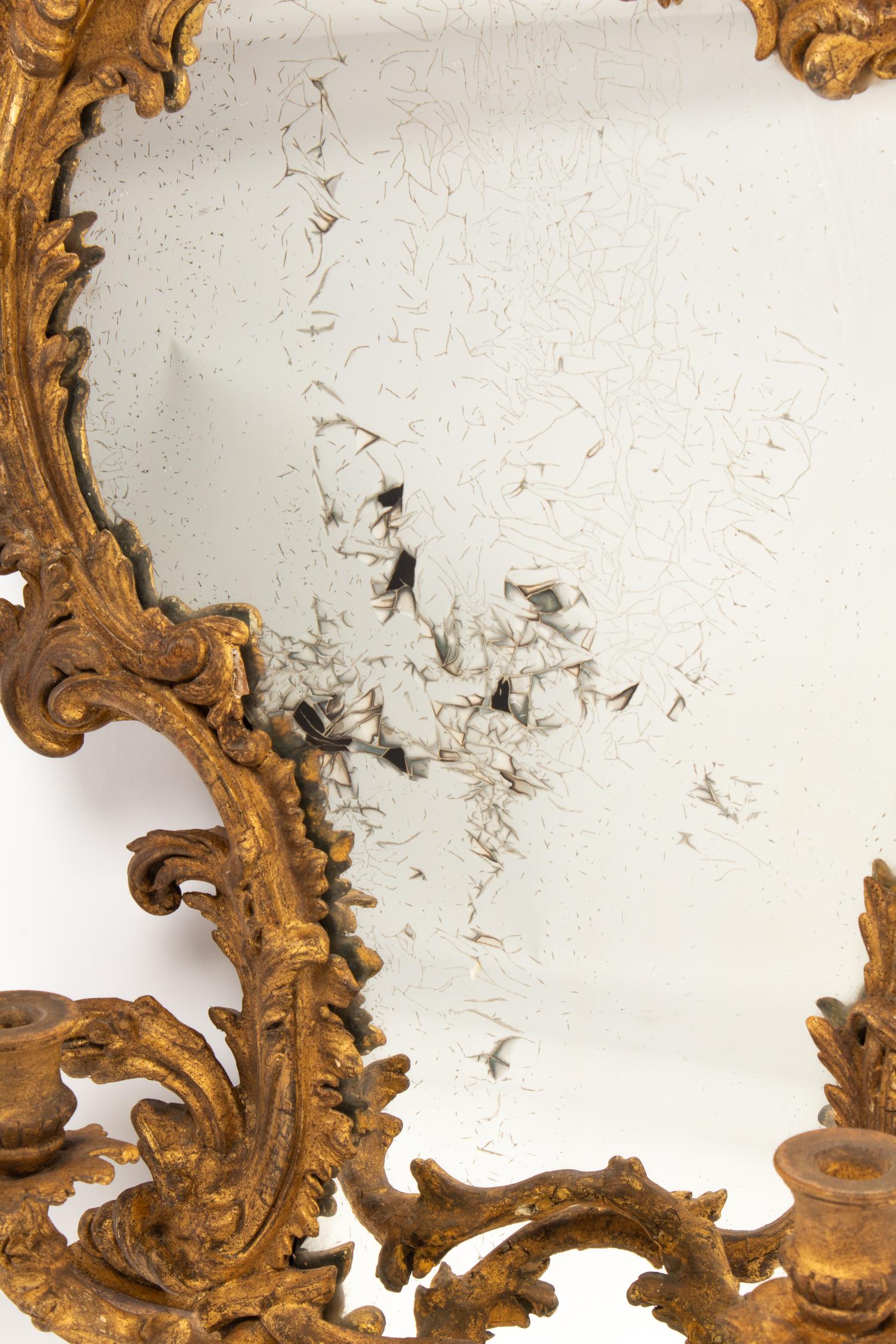 A Pair of Italian Carved Giltwood Girandole Mirrors