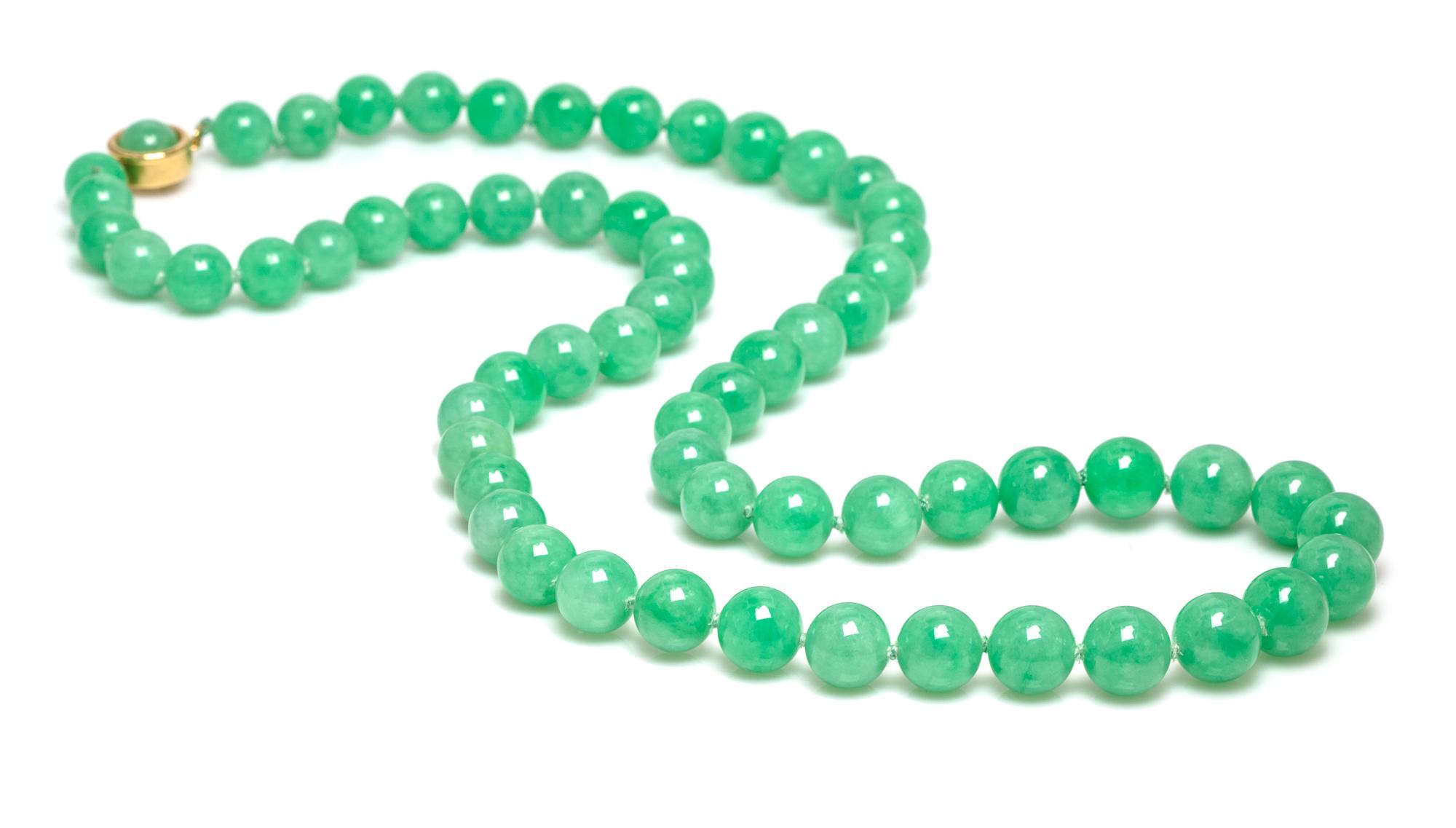 A Graduated Single Strand Jadeite Jade Bead Necklace,