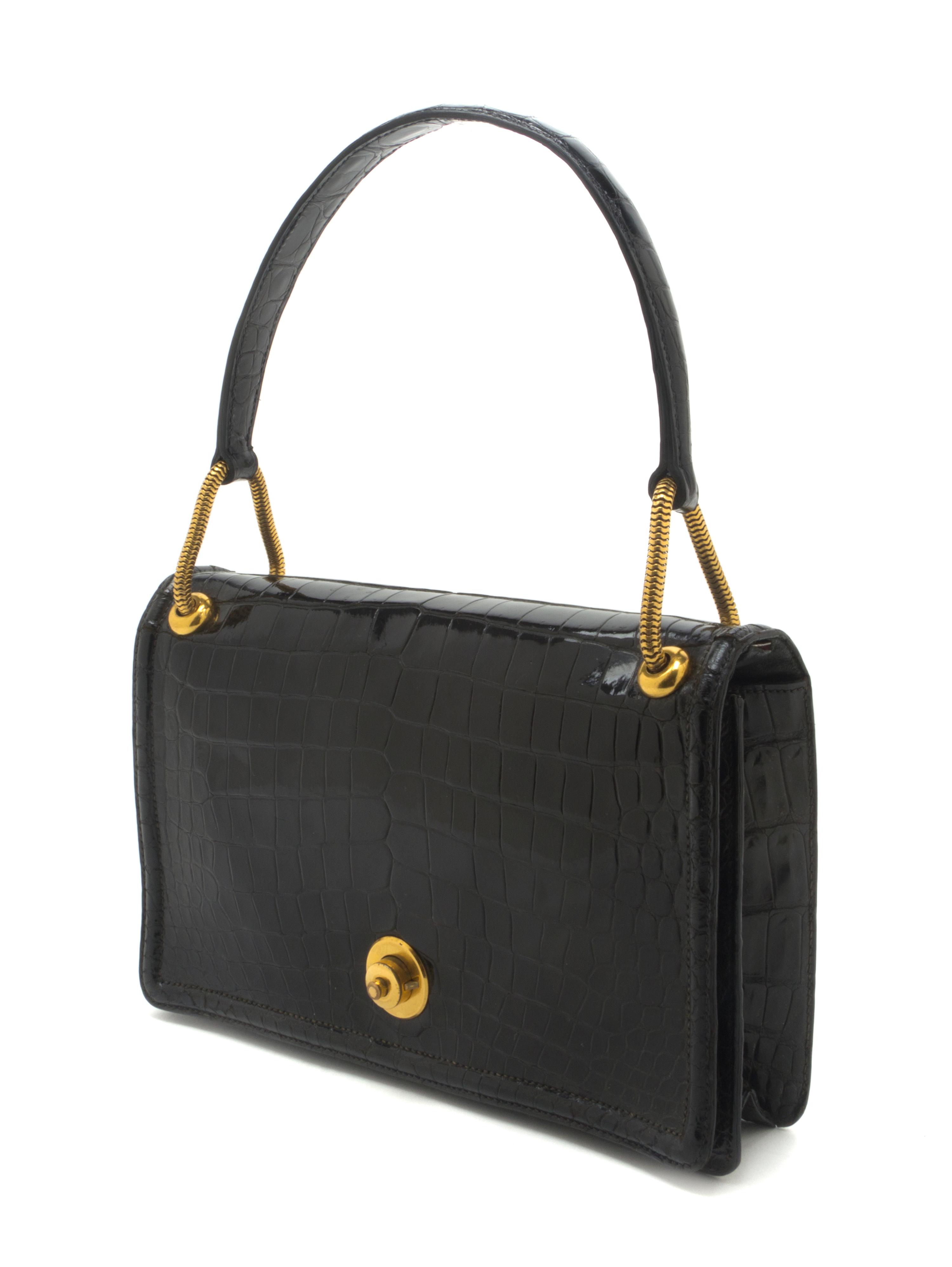 An Hermes Black Shiny Porosus Crocodile Piano Bag, 9 x 5 1/2 x 2 inches.