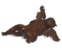 An Italian Baroque carved walnut angel, 17th century