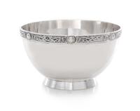 A George V Silver Bowl, Wakely & Wheeler, London, 1935, Retailed by Asprey, the rim worked to show a band of Celtic motifs, raised on a