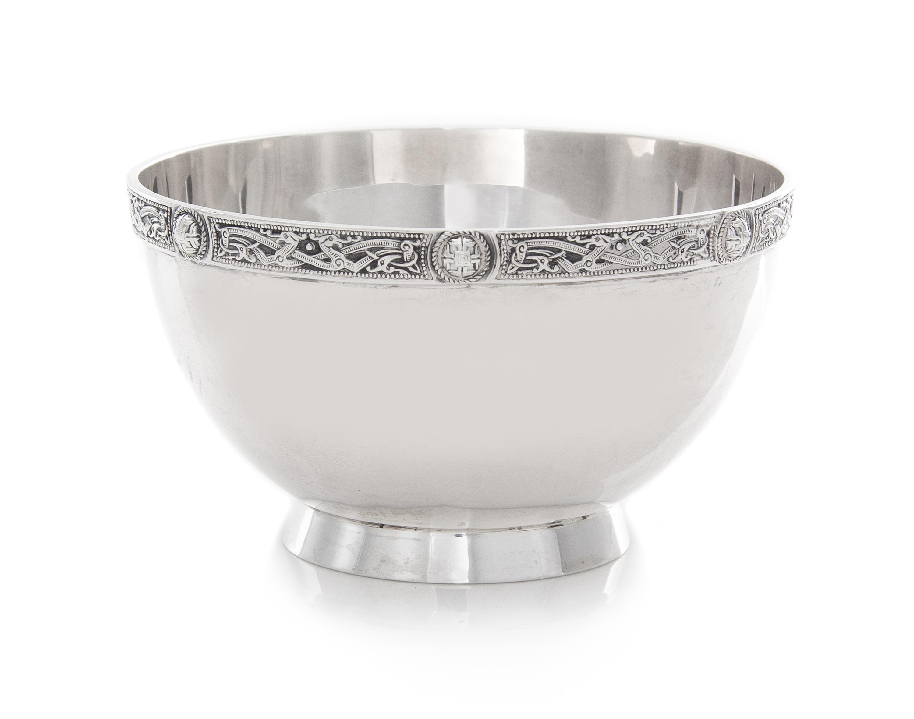 A George V Silver Bowl, Wakely & Wheeler, London, 1935, Retailed by Asprey, the rim worked to show a band of Celtic motifs, raised on a