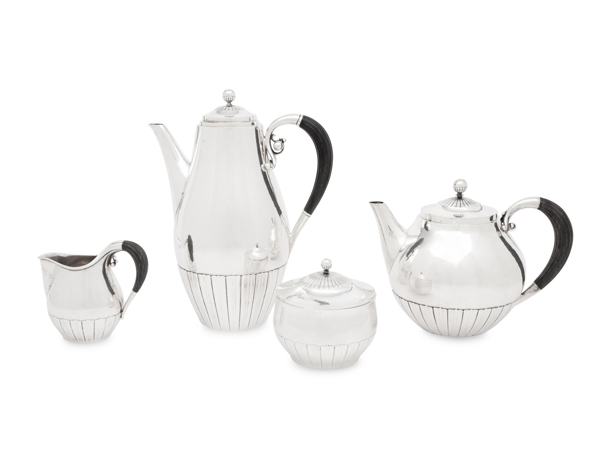A Johan Rohde for Georg Jensen Cosmos Silver Four-Piece Tea Service