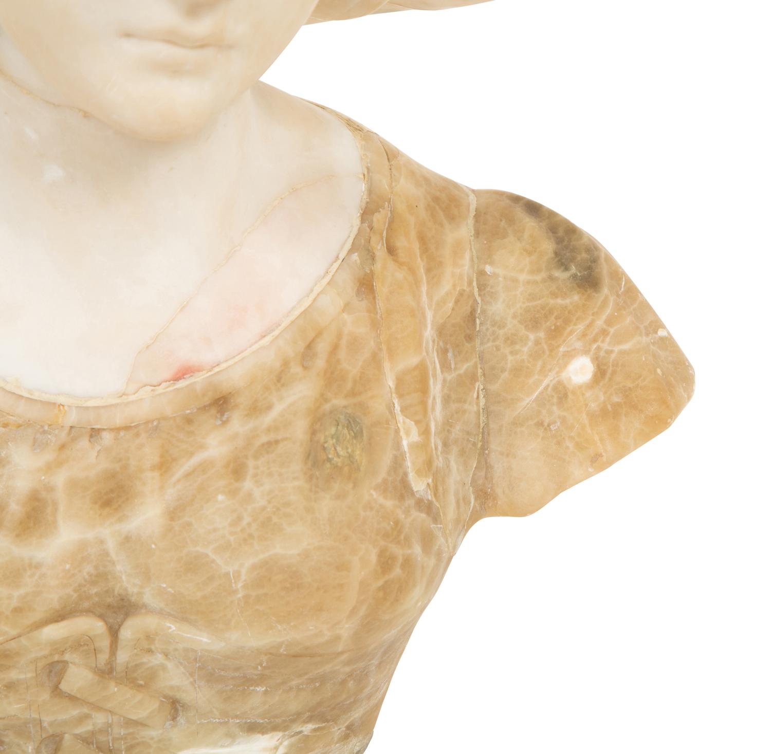 A Continental Carved Alabaster Bust of a Young Maiden