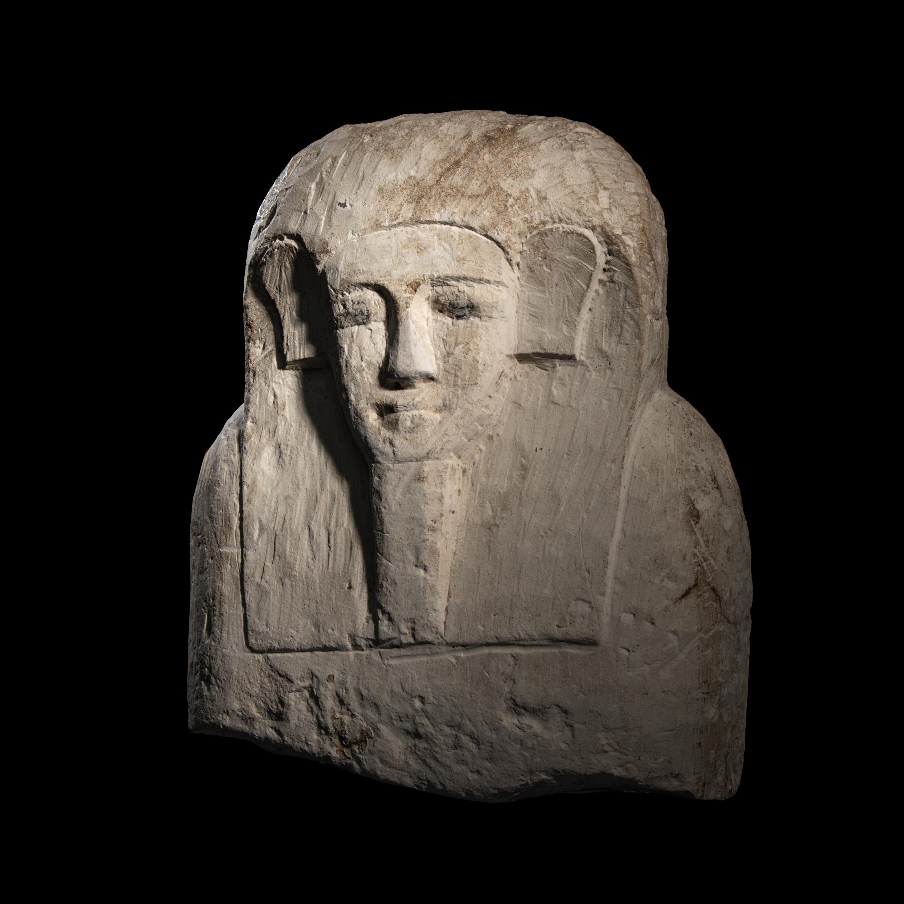 An Egyptian Limestone Sarcophagus Lid