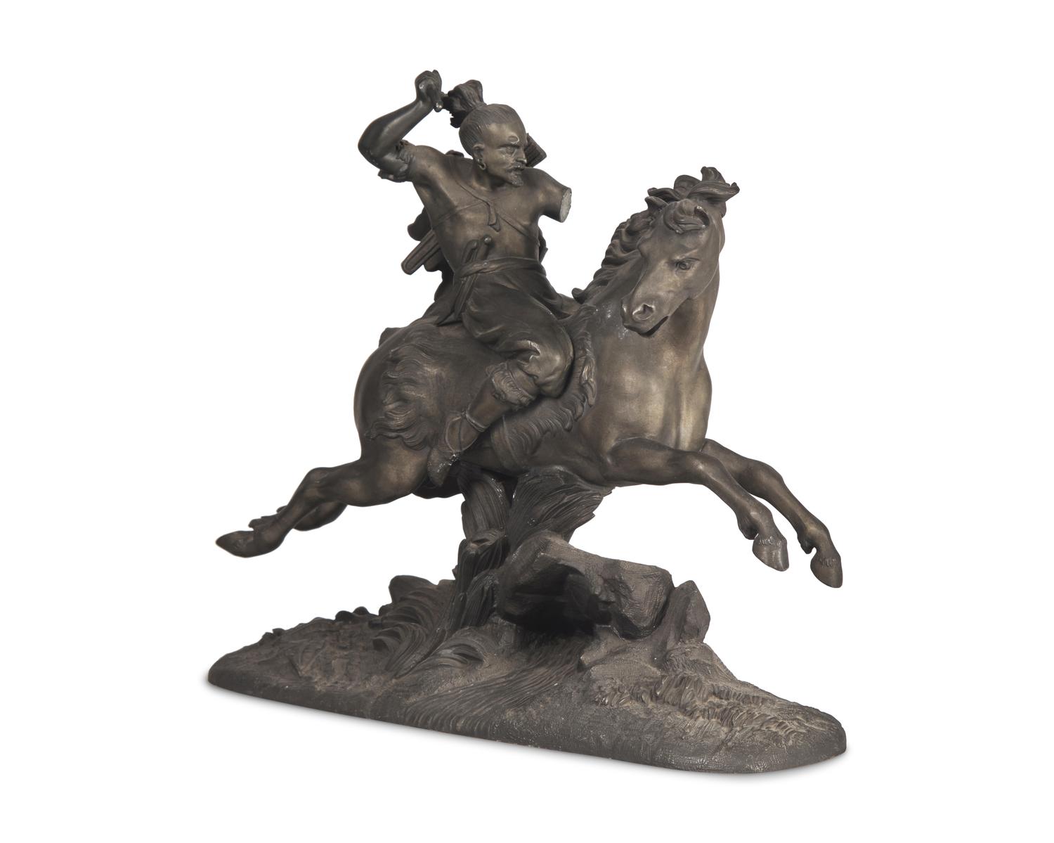 A Patinated White Metal Figure of a Native American Hunter on Horseback