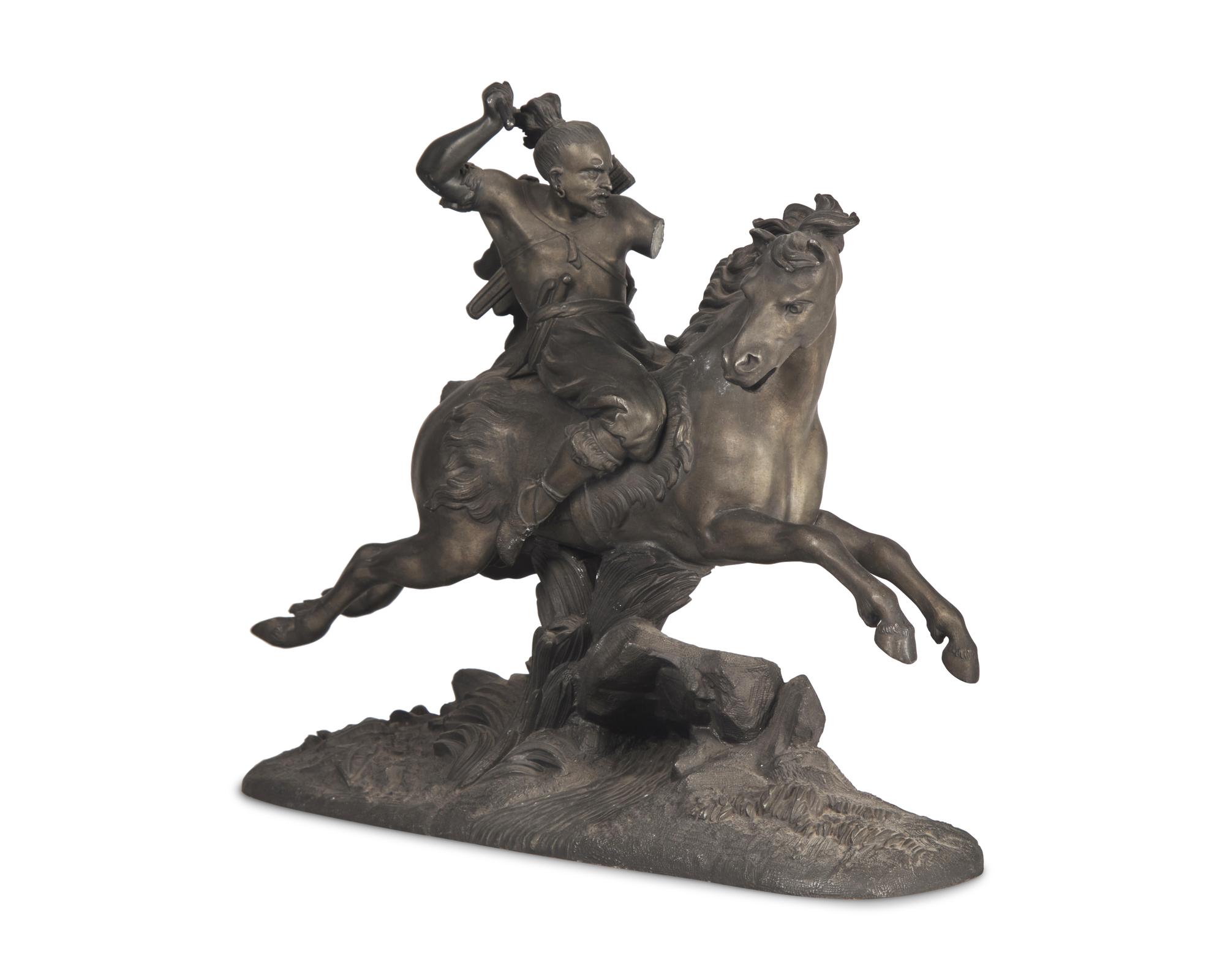 A Patinated White Metal Figure of a Native American Hunter on Horseback